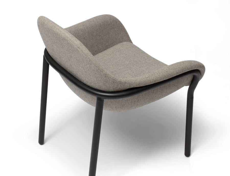 Bowler designer lounge chair by Matsu, designed by Joeri Reynaert, featuring a soft curved upholstered seat with premium Gabriel fabric
