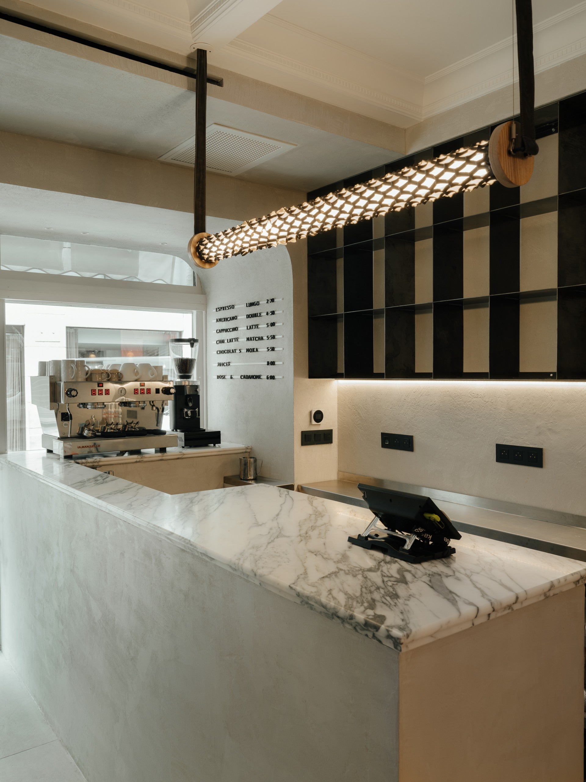 Cafe Moka Paris with the Matsu Nomad Mesh Lamp in Yak Leather