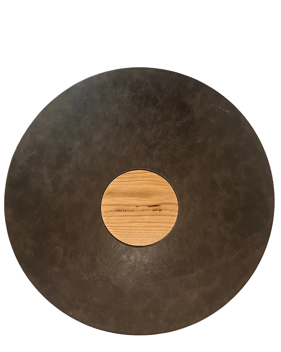 matsu kvn nomad coffee table in yak leahter with a base in cement