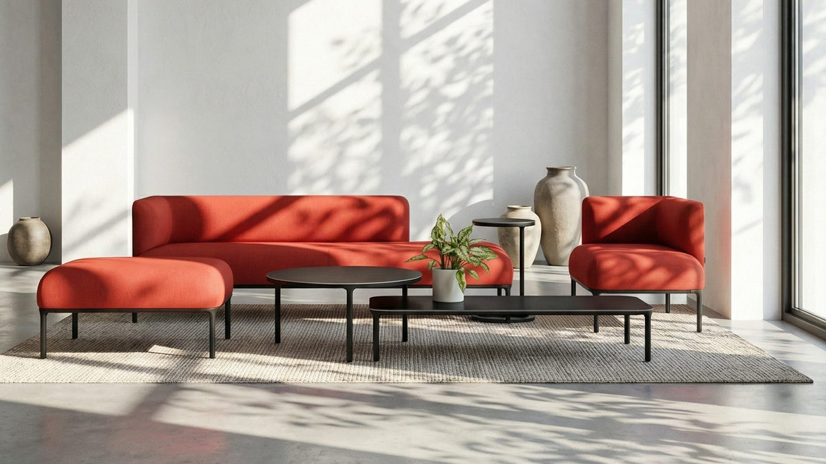 MATSU Prestige sofa, ottoman and armchair in red in a bright loft