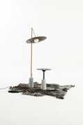 NOMAD Drumroll floor lamp with wood, cement and yak leather – studio shot