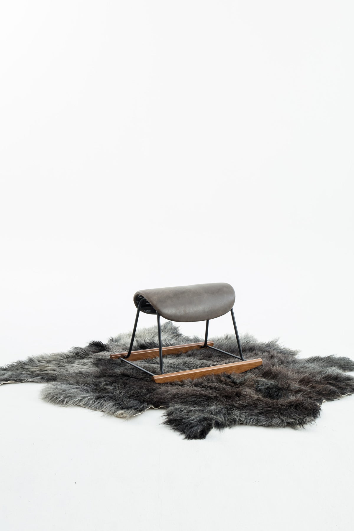 NOMAD Wrangler rocking chair on yak skin rug – studio shot